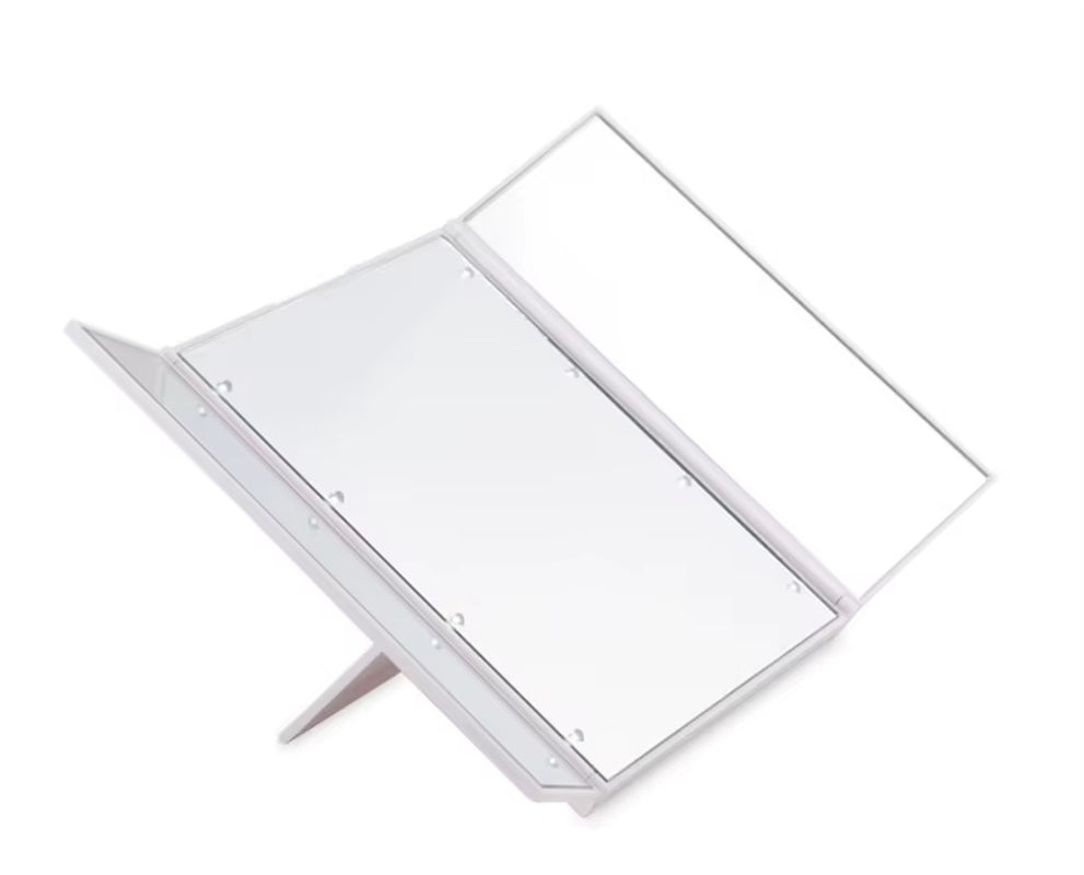 Portable LED vanity mirror – pocket-sized, foldable, and ideal for on-the-go makeup.