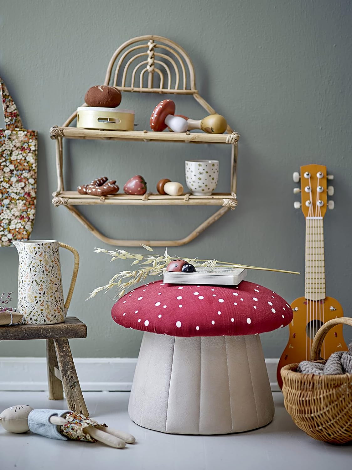 A mushroom-shaped kids’ seat with a soft red polka dot cover and a sturdy MDF base. Perfect as a footrest or extra seat.