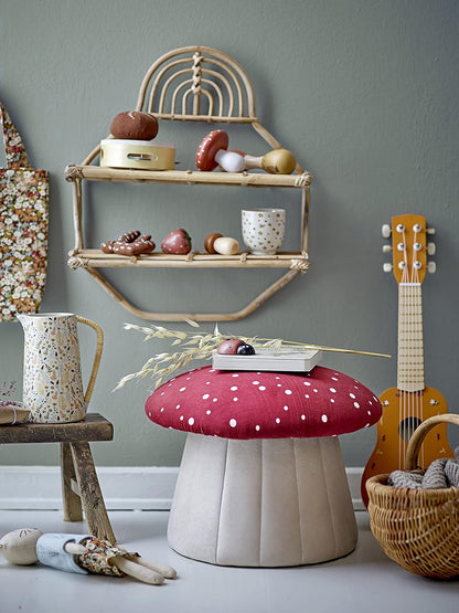 A mushroom-shaped kids’ seat with a soft red polka dot cover and a sturdy MDF base. Perfect as a footrest or extra seat.