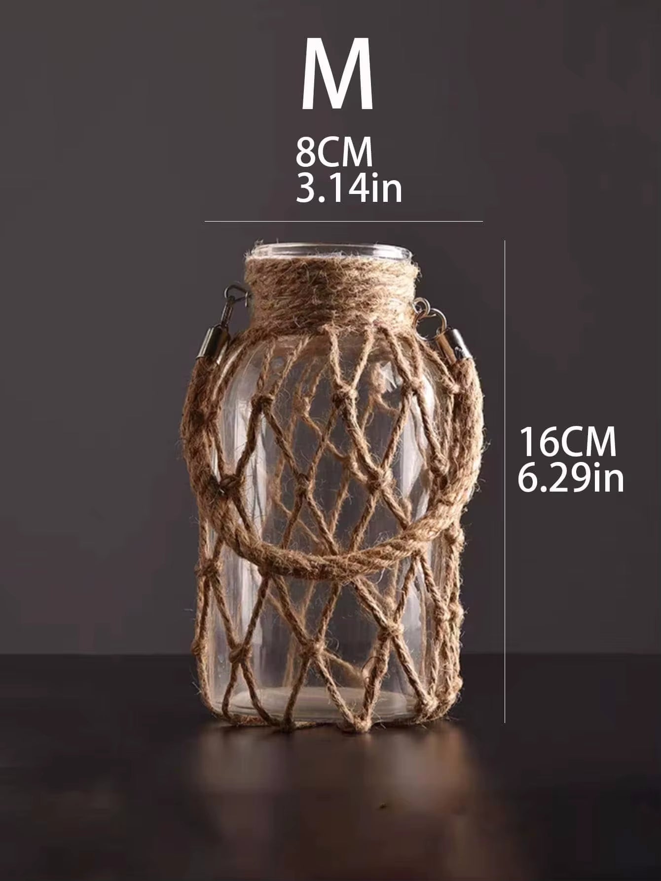 A hand‑woven hemp rope glass vase — a clear glass vessel wrapped in natural hemp fiber. Perfect for dried flowers, it adds texture and warm, rustic charm. Ideal for boho, Nordic, or minimalist interiors.