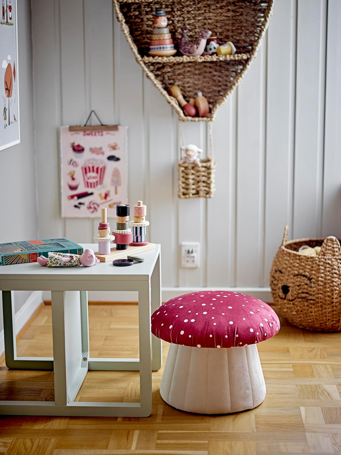 A mushroom-shaped kids’ seat with a soft red polka dot cover and a sturdy MDF base. Perfect as a footrest or extra seat.